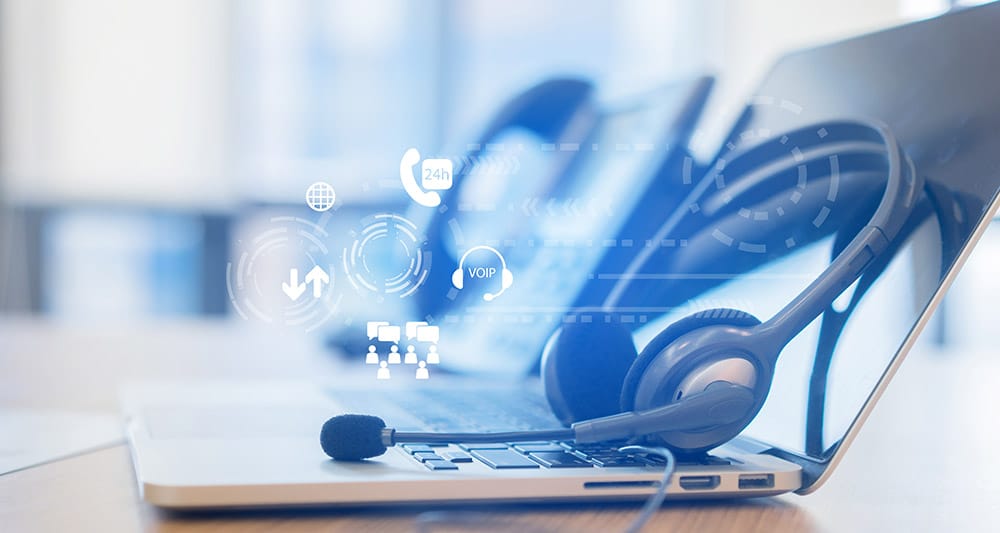 Headset on laptop computer in call center